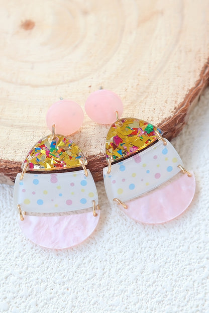 Hop into spring with a little sparkle. These adorable Easter egg-shaped drop earrings are the perfect way to celebrate the season in style. Featuring a soft pink hue and whimsical printed patterns, they’re sweet, festive, and totally charming.