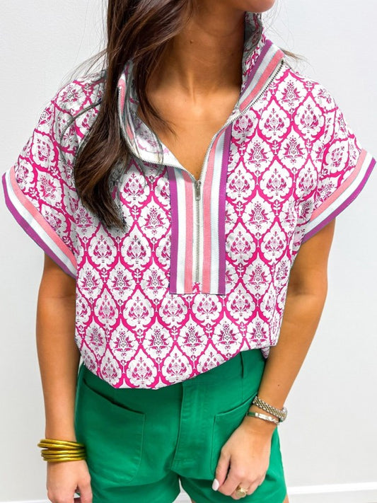 Bold pink colorblocking paired with a striped collar gives this blouse a playful boho twist. 