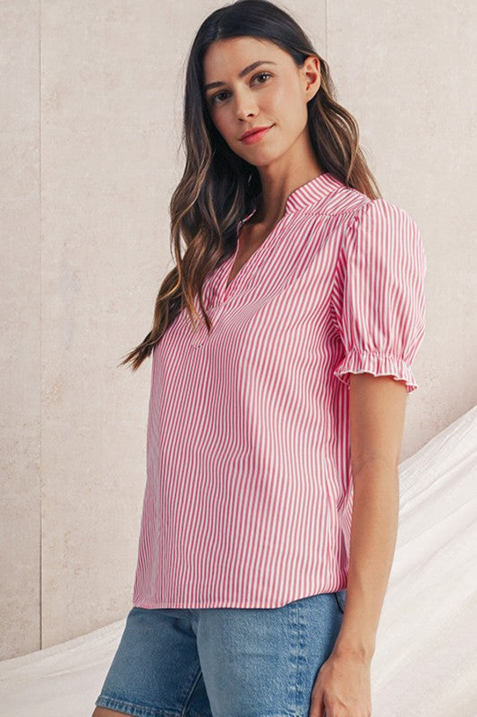 Short puff sleeves that give a playful, feminine silhouette. 