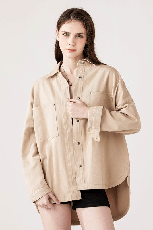 Plus-size oversized shacket crafted from 100% cotton twill.