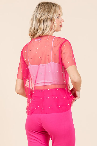 Fabric care is simple — hand wash cold, preserves the mesh and embellishments. 