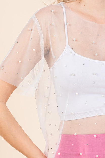 Mix and match style — pair with solid skirts, jeans, or shorts so embellishments stand out.