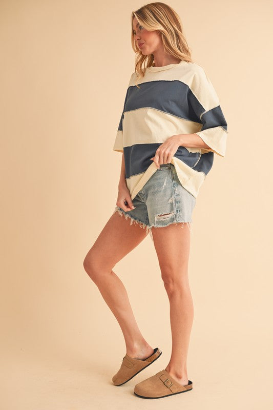 Seams are intentionally visible for a trendy, deconstructed look. 