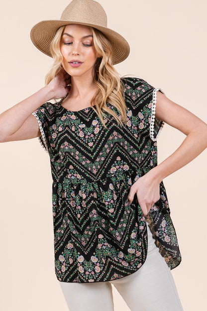Soft, breezy fabric with lace trim and pom-pom touches for a charming boho look.