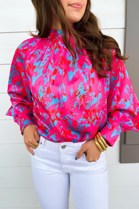Bold purple print gives this blouse an eye-catching, vibrant look. 