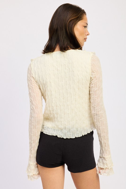 Gentle gathers under ruffles for a flattering drape. 