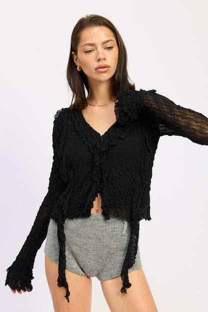 Hem hits at hip length — good for tucking or leaving out. 