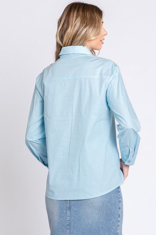 A long-sleeve, collared shirt with rhinestone detail that brings subtle luxury to your look.
