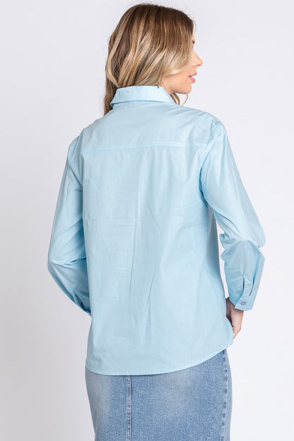 A long-sleeve, collared shirt with rhinestone detail that brings subtle luxury to your look.