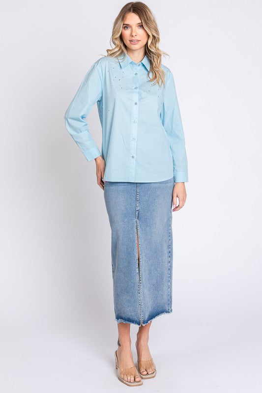 Flashy yet refined — a solid base shirt elevated by rhinestone embellishment.