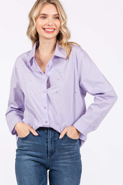 This versatile blouse shines with rhinestone accents, ideal for work or nights out.