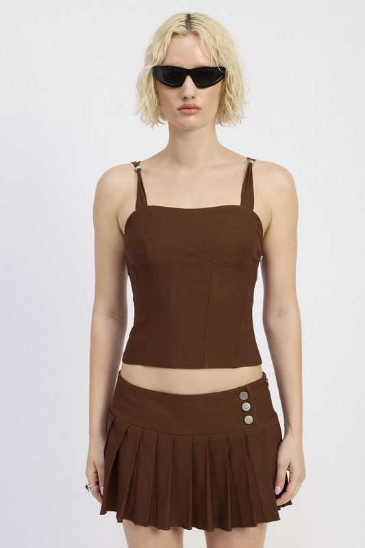 Hardware ring detail gives a metallic accent — match with accessories.