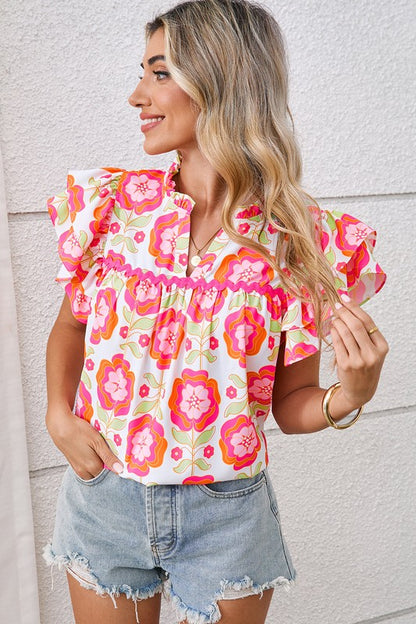 Ruffle sleeves add playful volume and a romantic silhouette. 