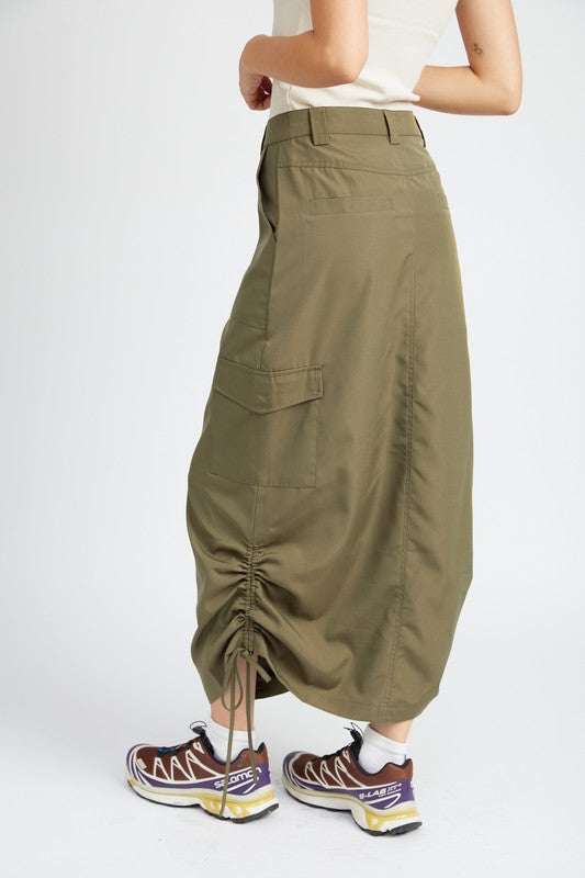 Person wearing olive green cargo skirt