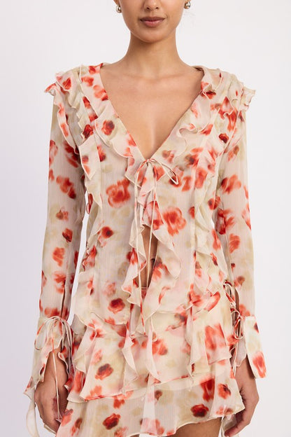 Delicate ruffle trim along the neckline and hem adds a feminine flair. 