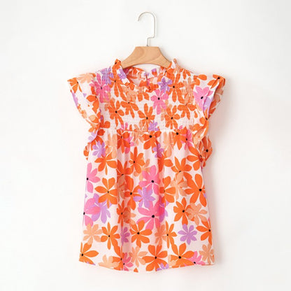 Frilled sleeves and keyhole-button back bring feminine, romantic details. 