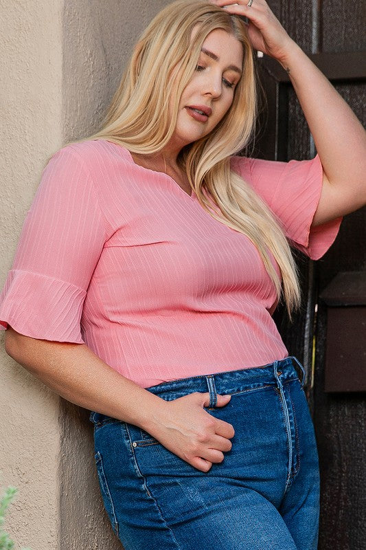 Relaxed plus-size fit — pairs effortlessly with jeans, skirts, or shorts. 