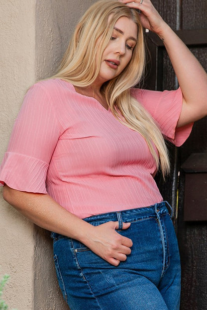 Relaxed plus-size fit — pairs effortlessly with jeans, skirts, or shorts. 
