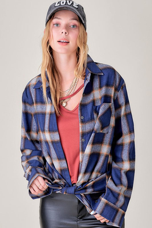 Classic plaid (or solid/subtle print, depending on variant) gives timeless appeal. (based on similar shirts) 