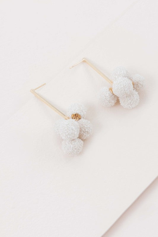 Soft texture. Simple charm. The Simple Life Pom Earrings in Beige are designed for effortless style with a cozy twist. Featuring plush pom-poms in a warm neutral tone, they’re perfect for casual days, cozy outfits, or adding a playful touch to minimalist looks.