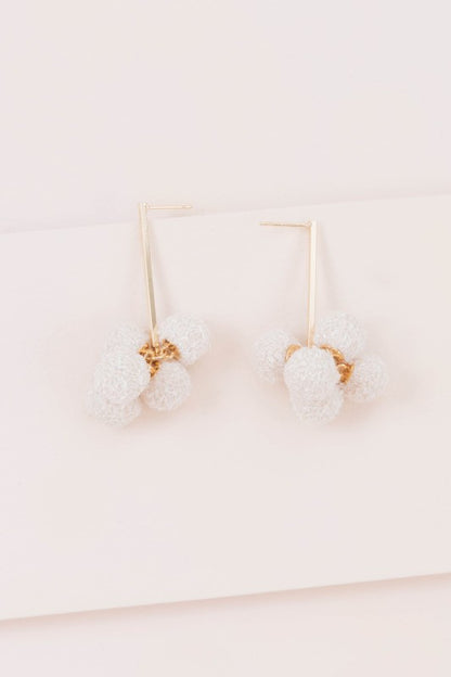 Soft texture. Simple charm. The Simple Life Pom Earrings in Beige are designed for effortless style with a cozy twist. Featuring plush pom-poms in a warm neutral tone, they’re perfect for casual days, cozy outfits, or adding a playful touch to minimalist looks.