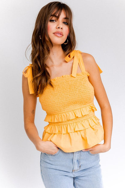 Sleeveless cut perfect for summer days, layering, or warm evenings.