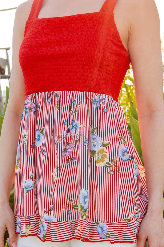 The elastic smock top molds beautifully to your curves while letting the bottom drift freely.