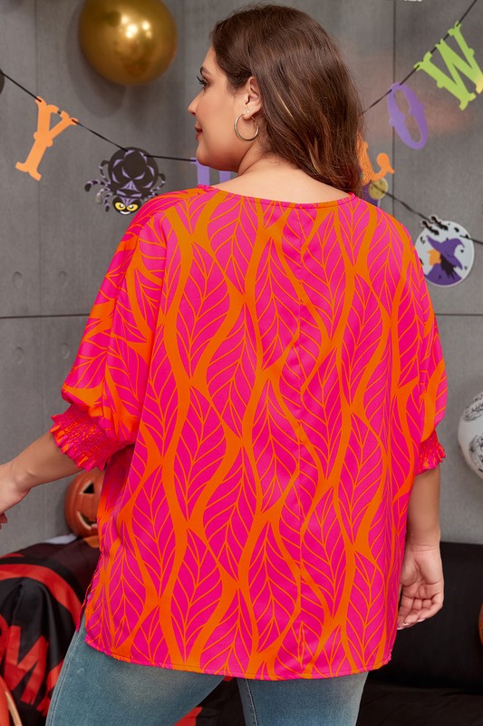Soft, round neckline balances the dramatic sleeve design.