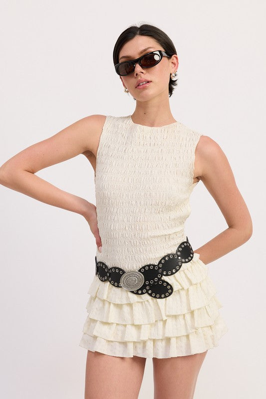 Elastic smocking allows flexibility in bust fit.
