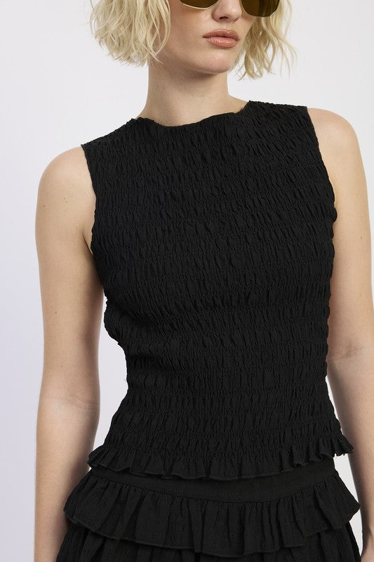 Open back tied or with keyhole accent (depending on design) for adjustability.