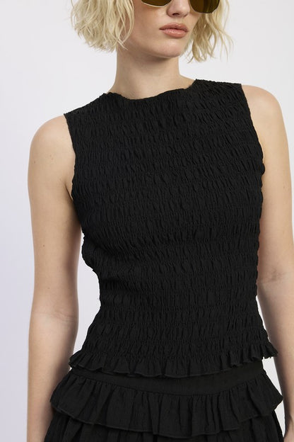 Open back tied or with keyhole accent (depending on design) for adjustability.