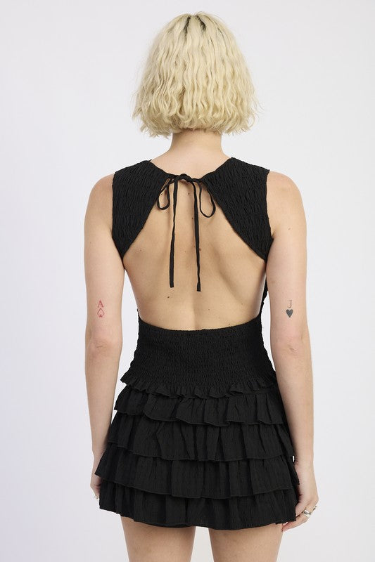 A stylish staple top that balances modest front and bold back design.