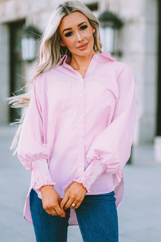 Oversized striped shirt with smocked cuffs and a chest pocket for a relaxed, stylish look.