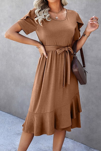 Woman wearing a petal sleeve wrap midi dress with ruffle trim and belted waist