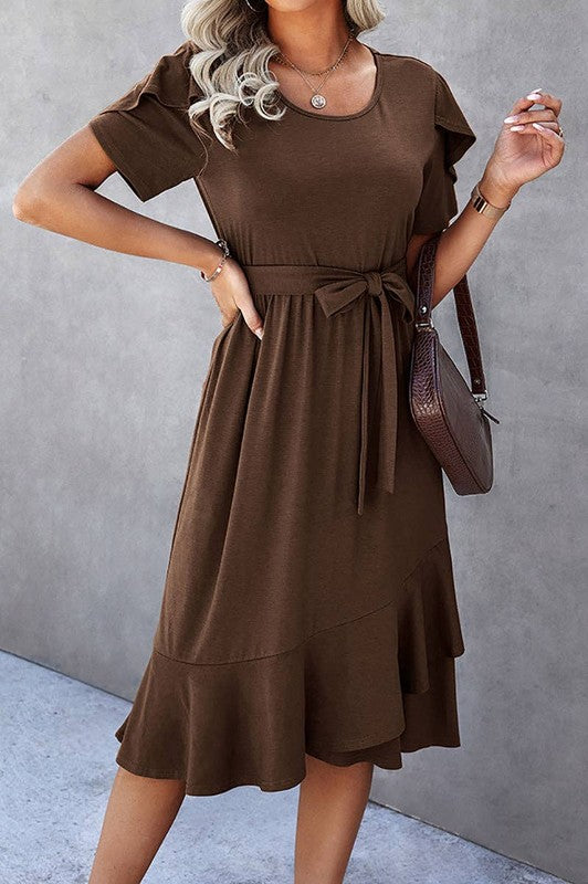 Woman wearing a petal sleeve wrap midi dress with ruffle trim and belted waist