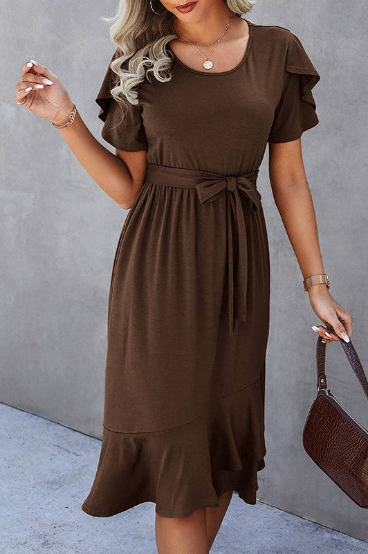Woman wearing a petal sleeve wrap midi dress with ruffle trim and belted waist