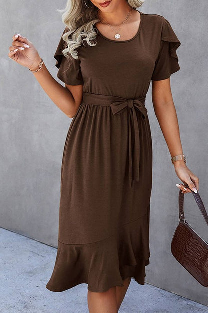 Woman wearing a petal sleeve wrap midi dress with ruffle trim and belted waist