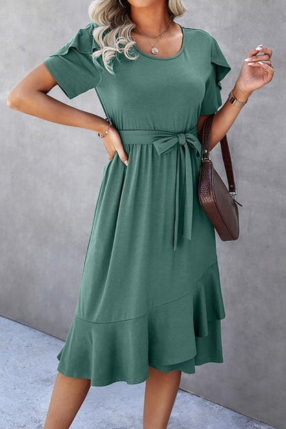 Woman wearing a petal sleeve wrap midi dress with ruffle trim and belted waist