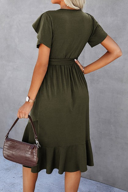 Woman wearing a petal sleeve wrap midi dress with ruffle trim and belted waist