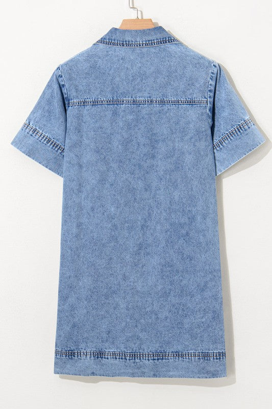 a short-sleeved, collared denim mini dress in faded blue wash, featuring a V-neckline, front patch pockets.