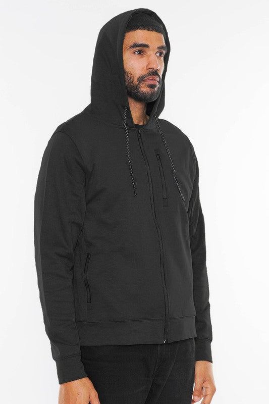 The solid Heathered Zip-Up Jacket features a sleek, versatile silhouette with a textured heathered finish and a full-zip front for easy layering.