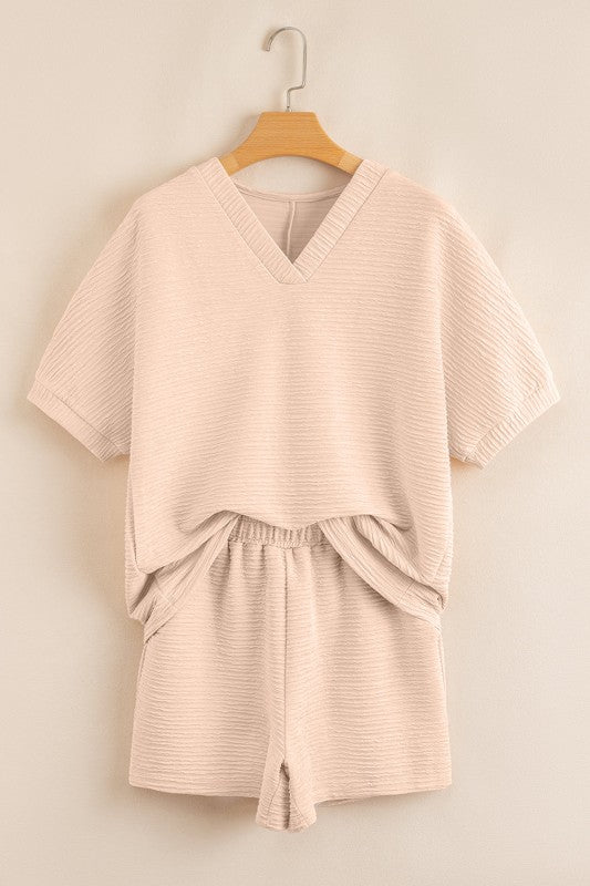 Effortless style. Everyday comfort. This two-piece set combines a textured tee and matching shorts for a laid-back look that’s anything but basic. Whether you're lounging at home or heading out for errands, this set keeps you cool, coordinated, and confident.