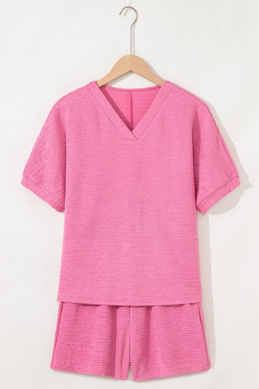 Effortless style. Everyday comfort. This two-piece set combines a textured tee and matching shorts for a laid-back look that’s anything but basic. Whether you're lounging at home or heading out for errands, this set keeps you cool, coordinated, and confident.