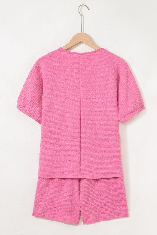 Effortless style. Everyday comfort. This two-piece set combines a textured tee and matching shorts for a laid-back look that’s anything but basic. Whether you're lounging at home or heading out for errands, this set keeps you cool, coordinated, and confident.