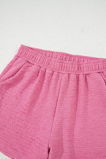 Effortless style. Everyday comfort. This two-piece set combines a textured tee and matching shorts for a laid-back look that’s anything but basic. Whether you're lounging at home or heading out for errands, this set keeps you cool, coordinated, and confident.