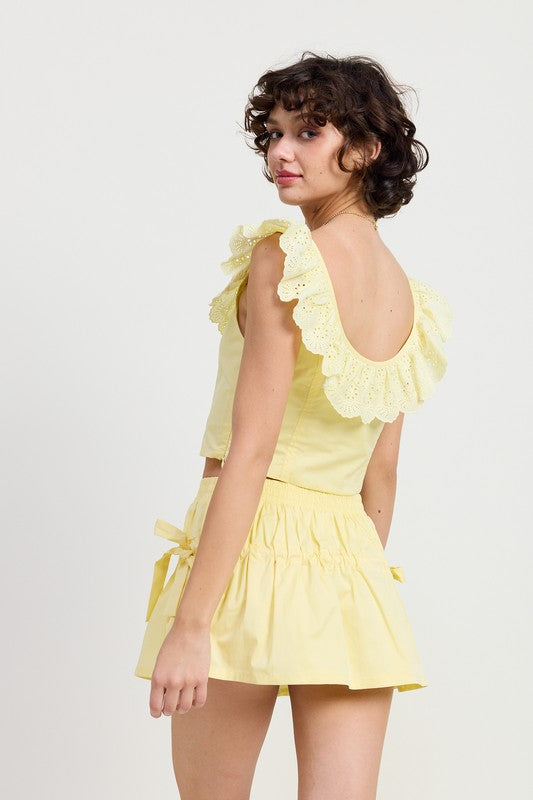 Imported piece, true to size (model wears Small, height ~5′9″). 