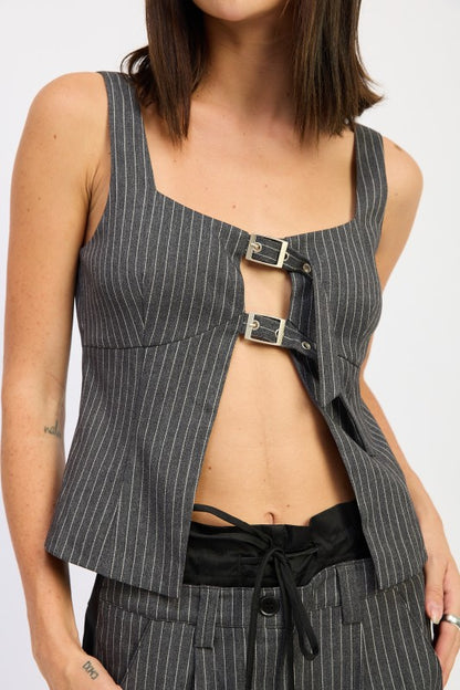 Buckle detail at the neckline adds an edgy, stylish accent. 