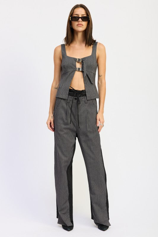 Sleeveless cut complements dresses up or casual bottoms. (if sleeveless; otherwise adjust to sleeve style) 