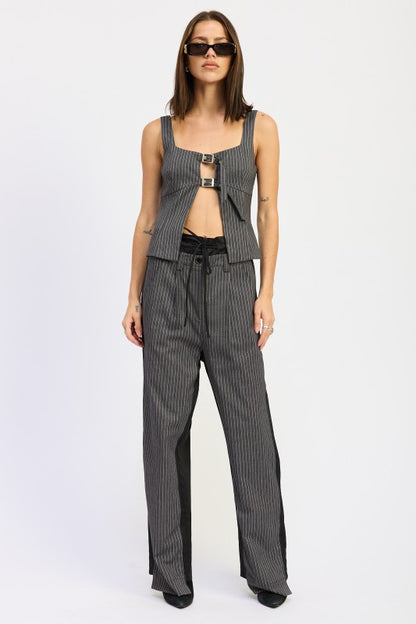 Sleeveless cut complements dresses up or casual bottoms. (if sleeveless; otherwise adjust to sleeve style) 