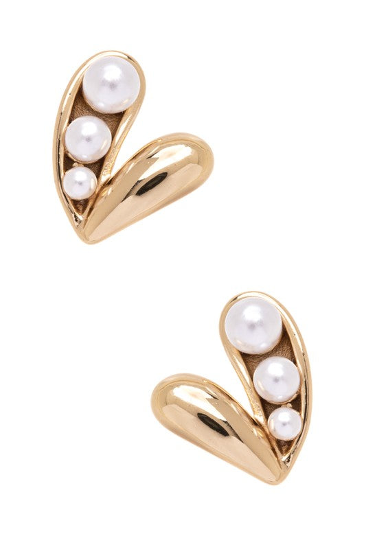 Gold earrings with a unique design. Each earring has a curved gold shape like a half-moon or a "C" facing downwards, with three pearls of different sizes set inside the curve. The background is plain white.